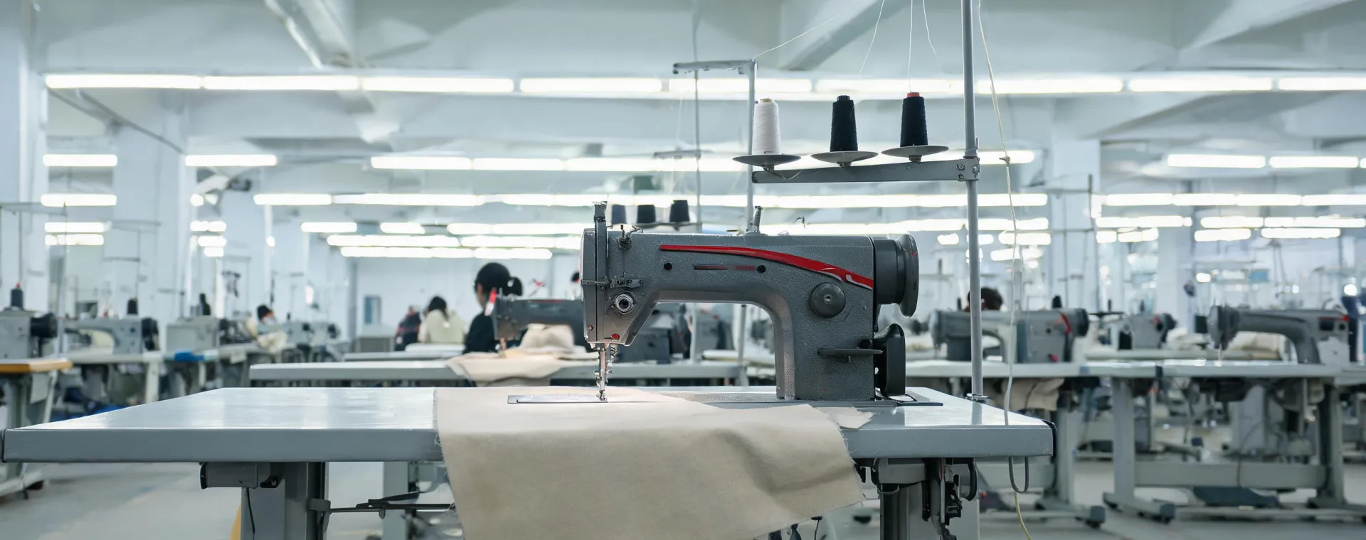 JUKI industrial sewing cell operating in an apparel production workshop